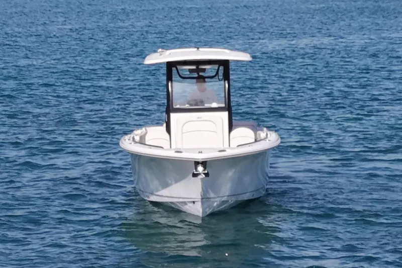 Slide: The Image of Sea Hunt Ultra 255 SE 2025 on calm water. - 7