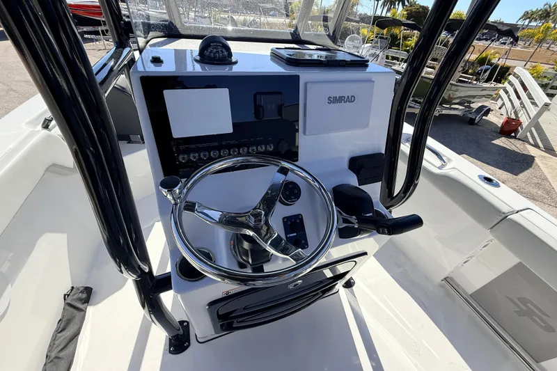 Slide: The Image of 2025 Sea Pro 225FLX Sandbar boat console with steering wheel and Simrad electronics. - 20