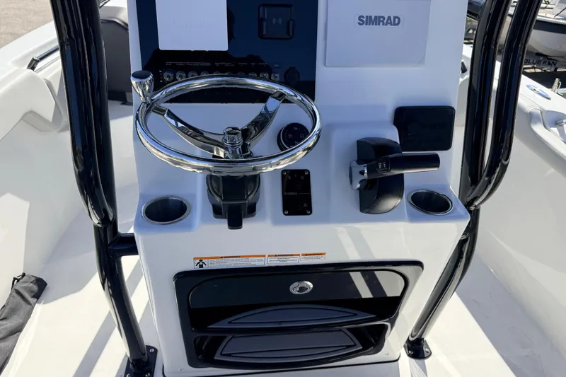 Slide: The Image of 2025 Sea Pro 225FLX Sandbar boat console with steering wheel and controls. - 30