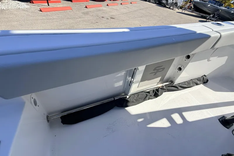 Slide: The Image of 2025 Sea Pro 225FLX Sandbar boat interior with storage compartment and seating. - 32