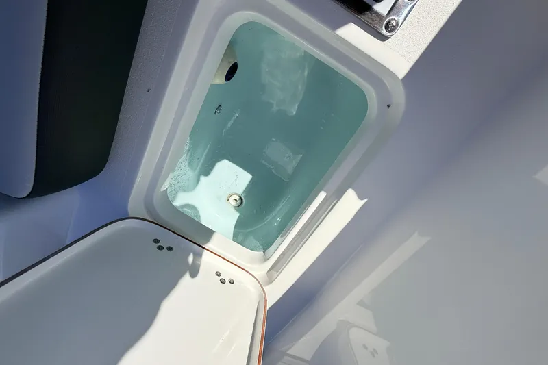 Slide: The Image of Livewell compartment on 2025 Sea Pro 225FLX Sandbar boat, filled with water. - 33