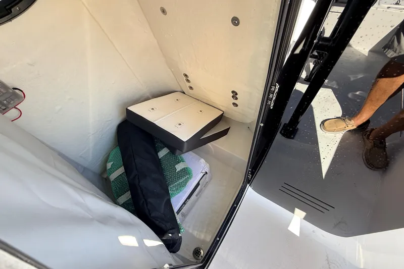 Slide: The Image of Interior view of 2025 Sea Pro 225FLX Sandbar boat storage compartment. - 36