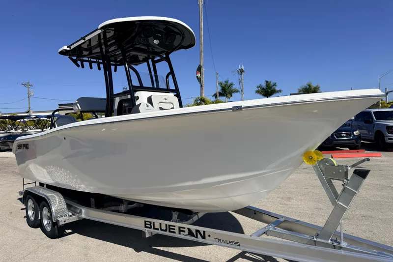 Slide: The Image of 2025 Sea Pro 225FLX Sandbar boat on Blue Fan trailer, parked outdoors. - 5