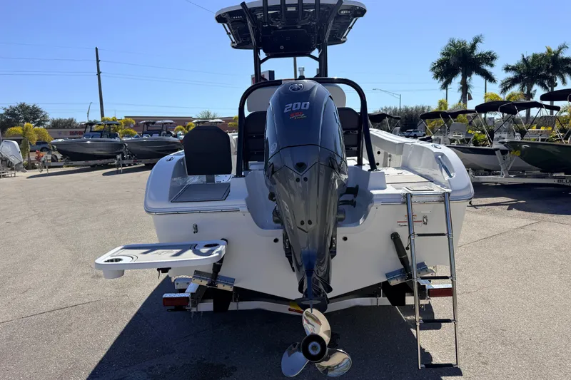 Slide: The Image of 2025 Sea Pro 225FLX Sandbar boat with Yamaha 200 engine, rear view in sunny marina. - 8