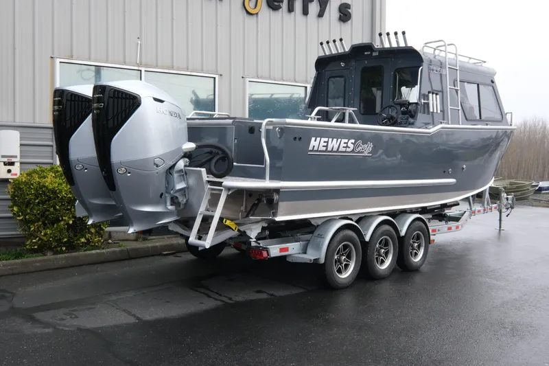 Slide: The Image of 2026 Hewescraft 270 Alaskan ET Hardtop boat on trailer with dual Honda engines. - 3
