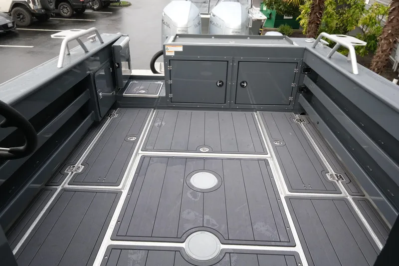 Slide: The Image of 2026 Hewescraft 270 Alaskan ET Hardtop boat deck with storage compartments. - 6