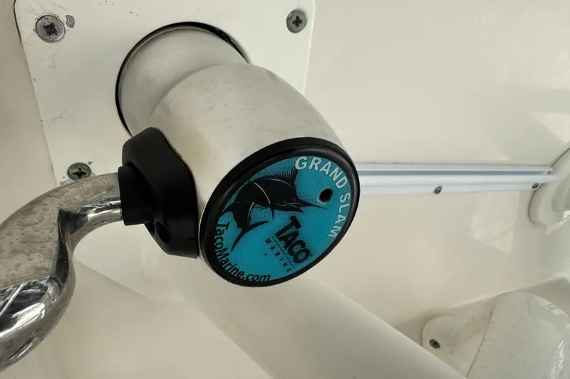 Slide: The Image of Close-up of a 2016 Sailfish 320 CC boat's mounted fishing rod holder. - 18