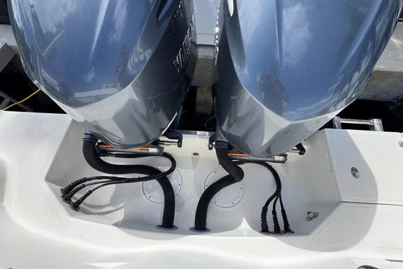 Slide: The Image of Twin outboard motors on a 2016 Sailfish 320 CC boat, docked. - 3