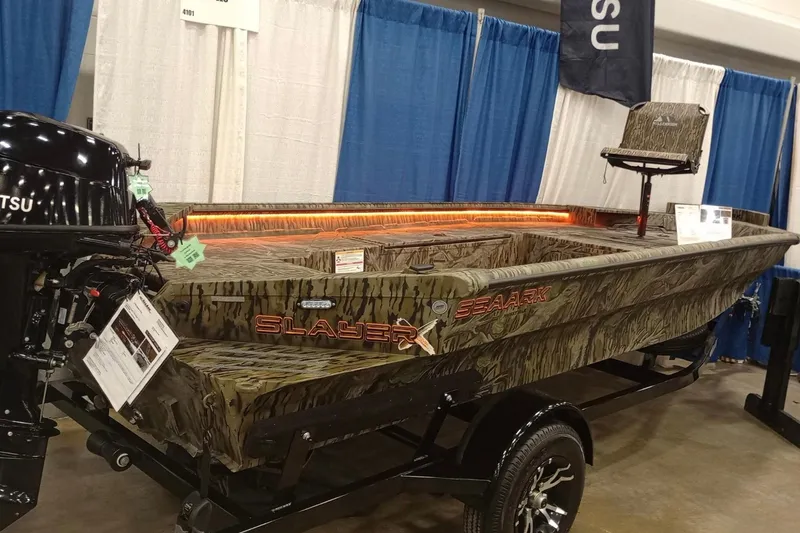 Slide: The Image of 2026 SeaArk 1752 Slayer X Pro boat with camouflage design on display. - 11
