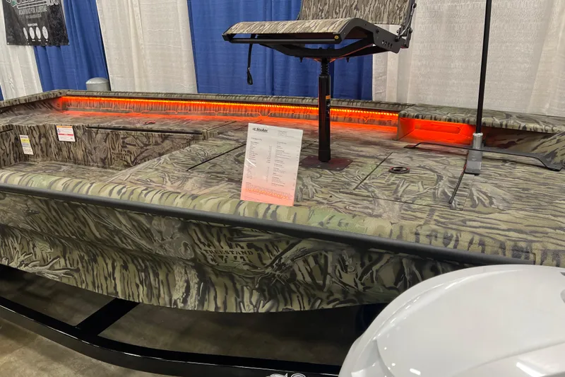 Slide: The Image of 2026 SeaArk 1752 Slayer X Pro boat with camouflage design and elevated seat display. - 12