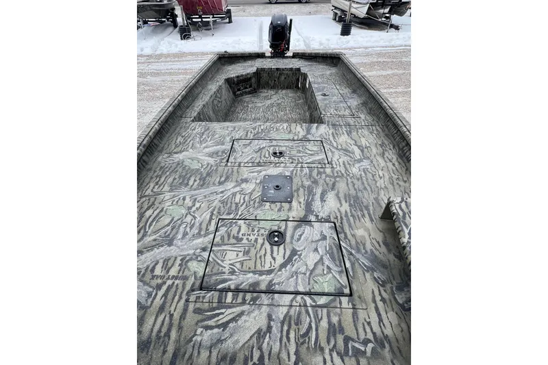 Slide: The Image of 2026 SeaArk 1752 Slayer X Pro boat with camouflage interior design. - 3