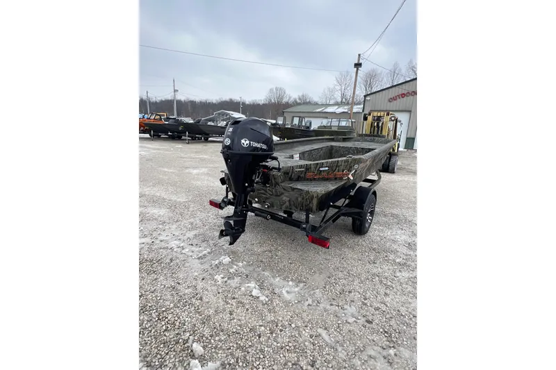 Slide: The Image of 2026 SeaArk 1752 Slayer X Pro boat with Tohatsu motor on gravel lot. - 6