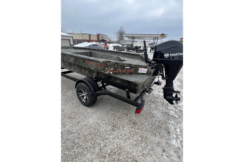 Slide: The Image of 2026 SeaArk 1752 Slayer X Pro boat with Tohatsu motor on snowy ground. - 8