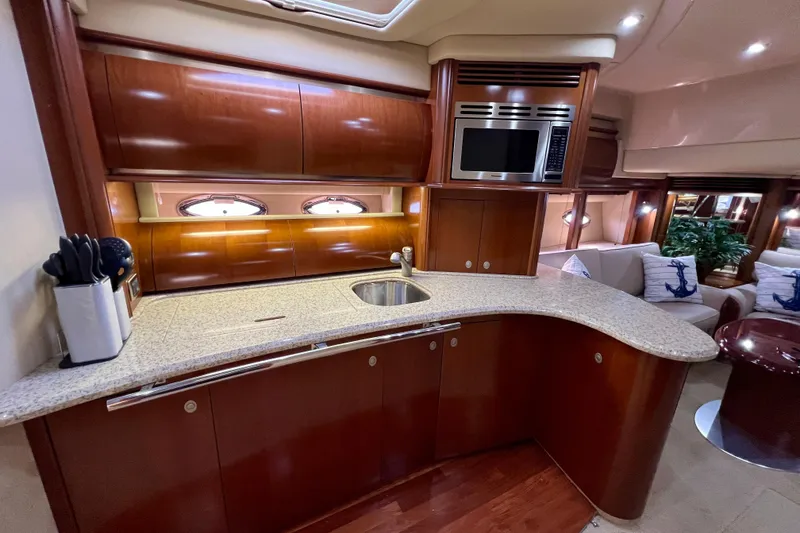 Slide: The Image of Luxurious 2005 Sea Ray 500 Sundancer yacht interior with elegant kitchen and seating area. - 17