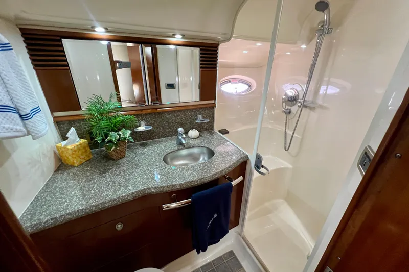 Slide: The Image of Luxurious bathroom in 2005 Sea Ray 500 Sundancer yacht with granite countertop and shower. - 22