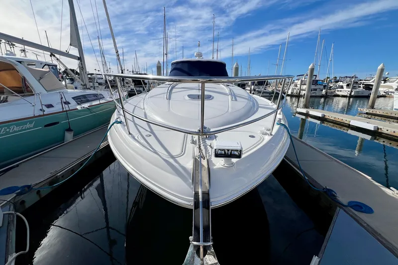 Slide: The Image of 2005 Sea Ray 500 Sundancer yacht docked at marina under blue sky. - 27