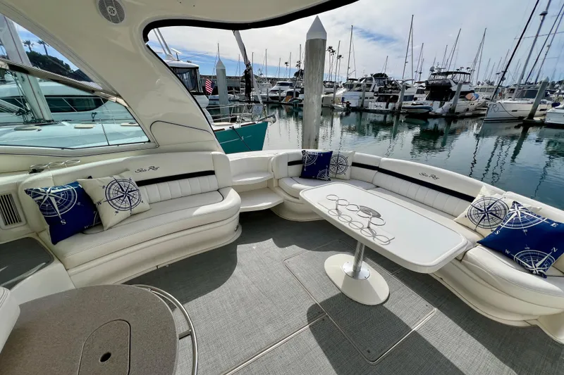 Slide: The Image of Luxurious 2005 Sea Ray 500 Sundancer yacht interior with elegant seating and marina view. - 4