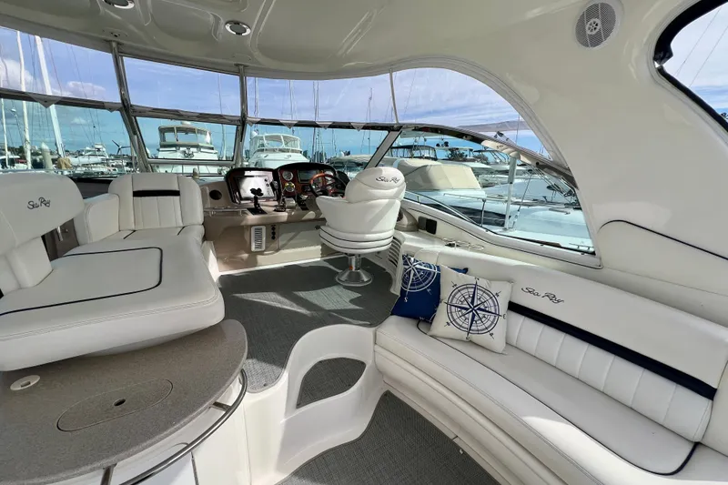 Slide: The Image of Luxurious 2005 Sea Ray 500 Sundancer yacht interior with plush seating and modern helm. - 6