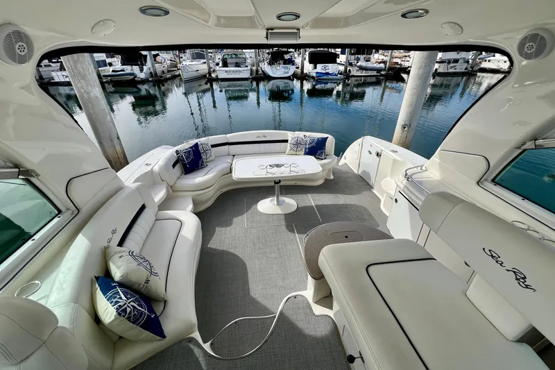Slide: The Image of Luxurious 2005 Sea Ray 500 Sundancer yacht interior with elegant seating and marina view. - 8