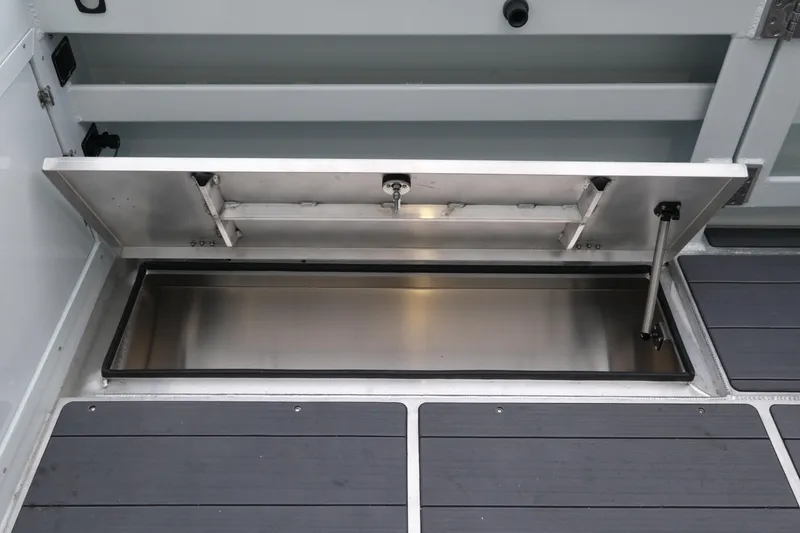 Slide: The Image of Open storage compartment on 2026 Hewescraft 270 Pacific Explorer boat. - 25