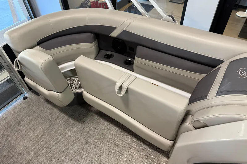 Slide: The Image of 2024 Barletta Cabrio C22UC boat interior with sleek gray seating and cup holders. - 19