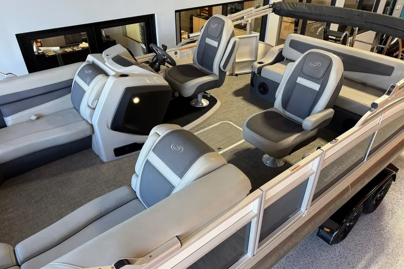 Slide: The Image of 2024 Barletta Cabrio C22UC pontoon boat on trailer in showroom. - 3