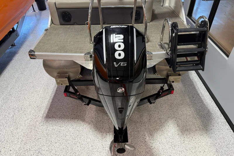 Slide: The Image of 2024 Barletta Cabrio C22UC boat interior with gray seating and carpeted flooring. - 9