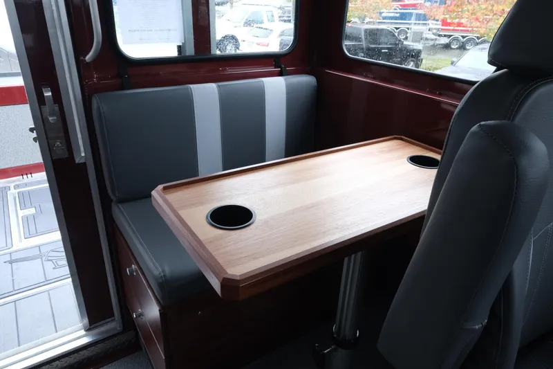 Slide: The Image of Interior of 2026 Hewescraft 240 Pacific Cruiser with table and seating. - 20