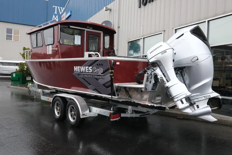 Slide: The Image of 2026 Hewescraft 240 Pacific Cruiser boat with Honda outboard motor on trailer. - 4