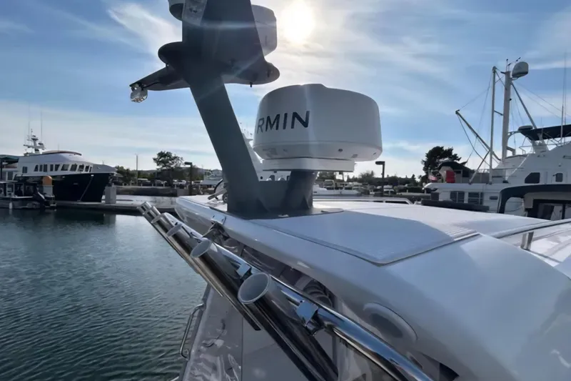 Slide: The Image of 2024 Flexboat 680 Explorer docked, featuring Garmin radar, under a bright sky. - 10