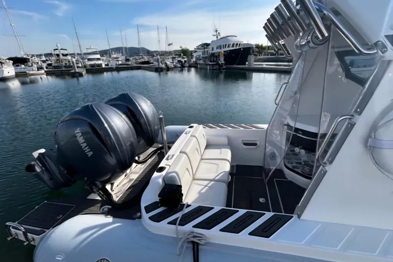 Slide: The Image of 2024 Flexboat 680 Explorer with Yamaha engines docked at a marina. - 13
