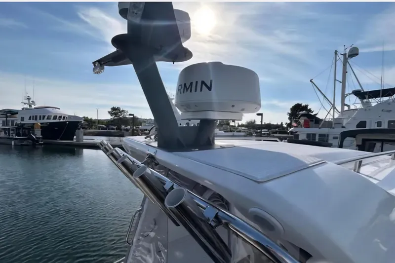 Slide: The Image of 2024 Flexboat 680 Explorer docked, featuring Garmin radar, under a clear sky. - 14