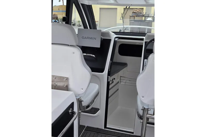 Slide: The Image of Interior view of 2024 Flexboat 680 Explorer with Garmin navigation system. - 22