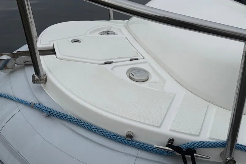 Slide: The Image of 2024 Flexboat 680 Explorer deck with railing and blue rope detail. - 25