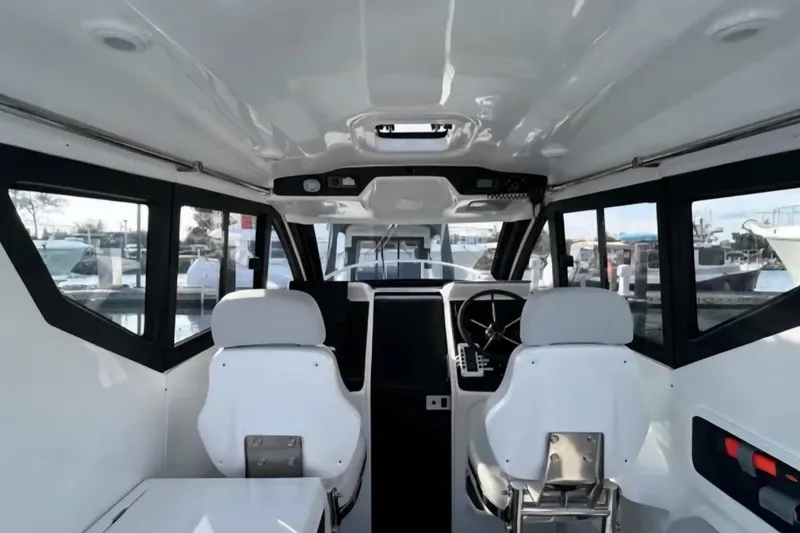 Slide: The Image of Interior of 2024 Flexboat 680 Explorer, featuring modern helm and seating. - 3