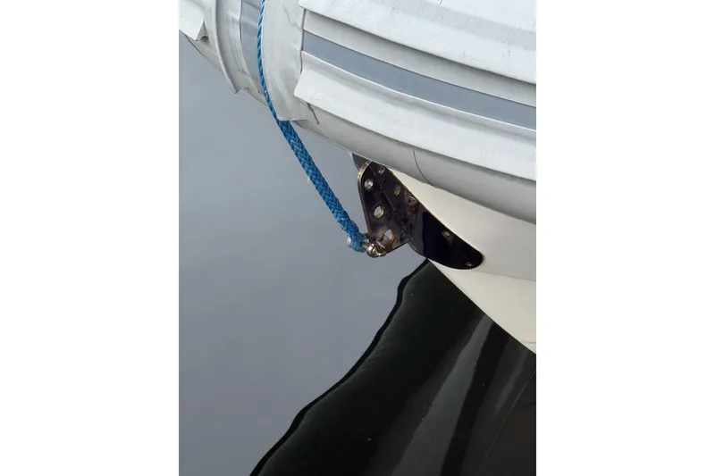 Slide: The Image of Close-up of 2024 Flexboat 680 Explorer bow with blue rope and water reflection. - 32