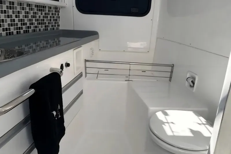 Slide: The Image of 2024 Flexboat 680 Explorer interior bathroom with modern fixtures and sleek design. - 7