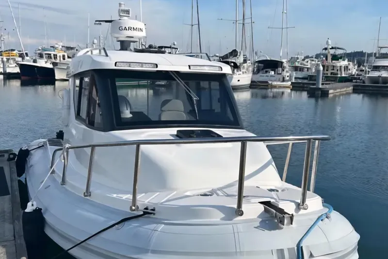 Slide: The Image of 2024 Flexboat 680 Explorer docked at a marina, surrounded by other boats. - 9