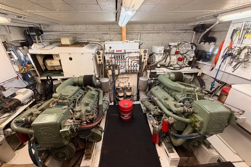 Slide: The Image of Engine room of a 1984 Hartman-Palmer 60 Flush Deck Motor Yacht, featuring dual engines. - 8