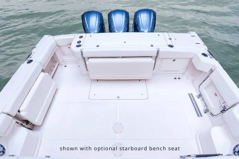 Slide: The Image of 2016 Grady-White Express 370 boat deck with optional starboard bench seat, featuring triple engines. - 5