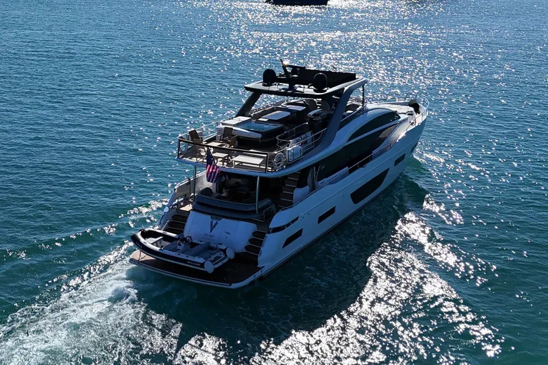 Slide: The Image of Luxurious 2022 Princess Y85 yacht cruising on sparkling blue water. - 11