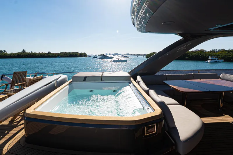 Slide: The Image of Luxurious 2022 Princess Y85 yacht with jacuzzi and seating area on deck. - 14