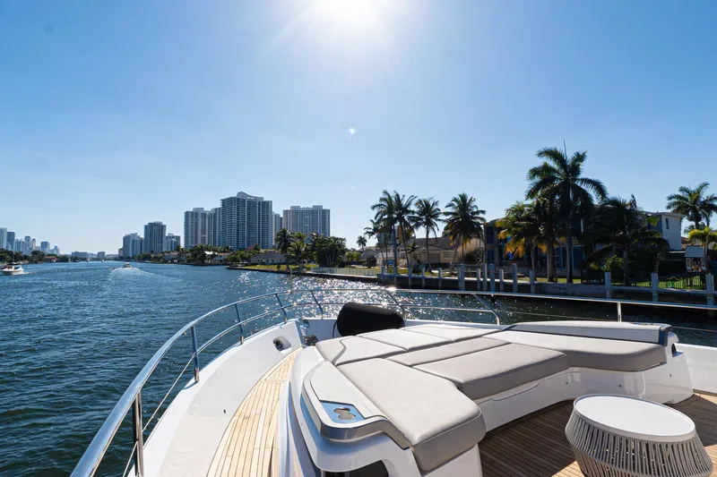 Slide: The Image of Luxurious 2022 Princess Y85 yacht cruising near waterfront cityscape under clear blue sky. - 16