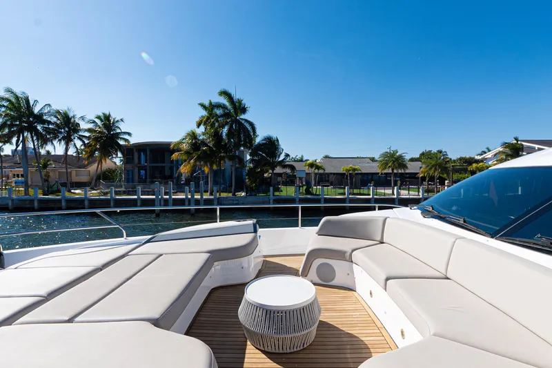 Slide: The Image of Luxurious 2022 Princess Y85 yacht deck with elegant seating and waterfront view. - 17