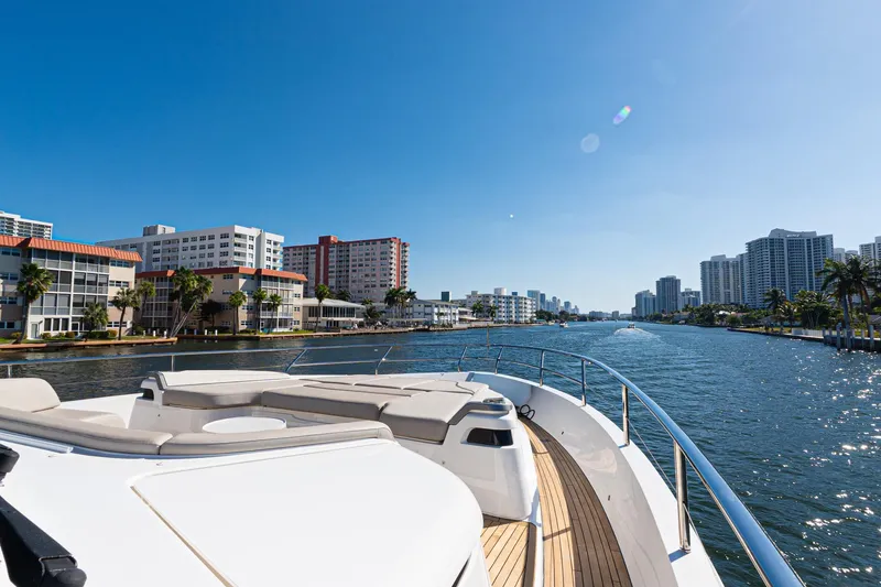 Slide: The Image of Luxurious 2022 Princess Y85 yacht cruising along a scenic urban waterfront. - 19