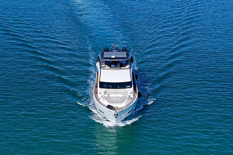 Slide: The Image of Luxury 2022 Princess Y85 yacht cruising on open blue water. - 2
