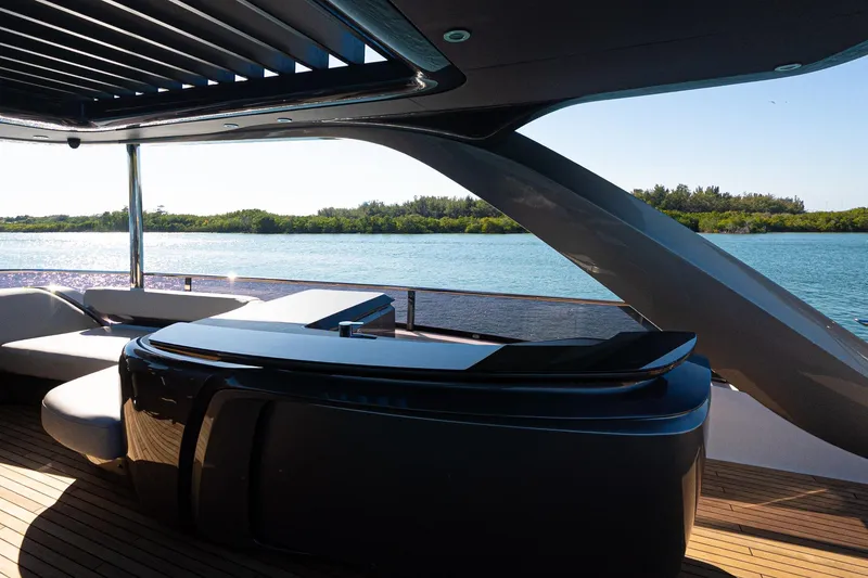 Slide: The Image of Luxurious 2022 Princess Y85 yacht deck with modern seating and scenic water view. - 26