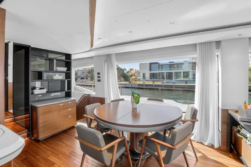Slide: The Image of Luxurious interior of 2022 Princess Y85 yacht with elegant dining area and waterfront view. - 33