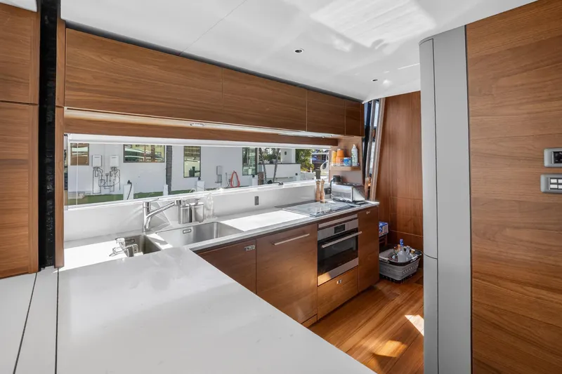 Slide: The Image of Luxurious kitchen interior of 2022 Princess Y85 yacht with modern wood cabinetry. - 38