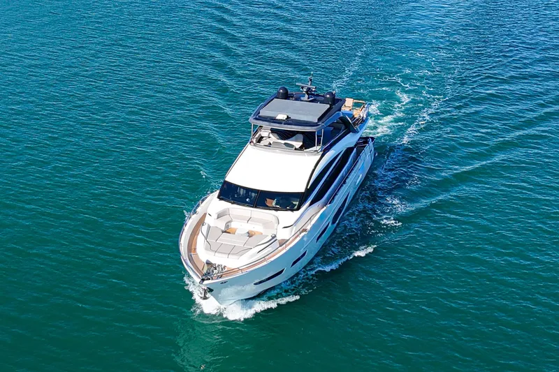 Slide: The Image of 2022 Princess Y85 yacht cruising on clear blue water. - 4